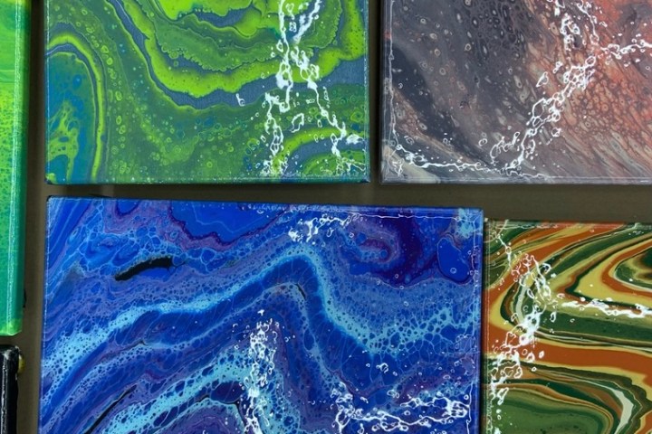 Abstract fluid art paintings with vibrant colors and swirling patterns.